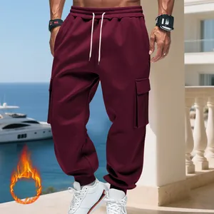 Close-up detail of men's burgundy heavyweight fleece cargo pants with pockets