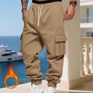 Detailed view of khaki fleece-lined men's cargo sweatpants set in a luxury resort