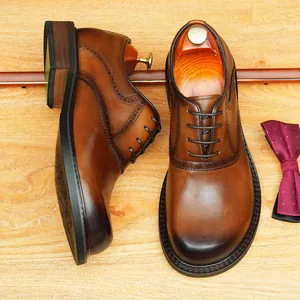 Classic brown hand-brushed leather brogue derby shoes with round toe for men