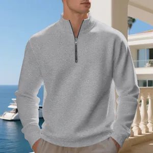 Men's casual grey half-zip sweatshirt featuring a warm fleece lining for winter wear