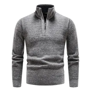 Men's grey half-zip knitted sweater featuring a classic textured pattern and high collar.