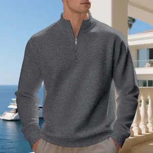 Close-up detail of dark grey men's quarter-zip fleece-lined sweatshirt in casual style