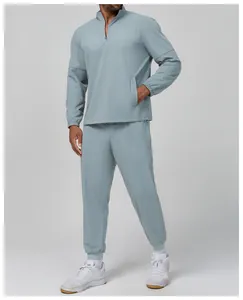 Men's light blue sporty set with quarter-zip top and joggers for outdoor commuting