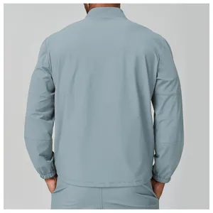 Detailed back view of lightweight men's stand-collar sports jacket in pale blue grey tone