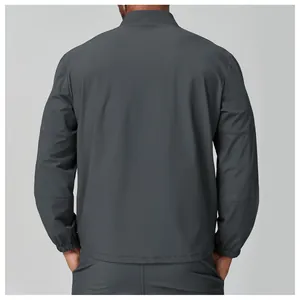 Back view of men's lightweight charcoal grey stand collar sports jacket for hiking