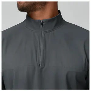 Close-up detail of a gray men's outdoor sport jacket with quarter-zip and stand collar
