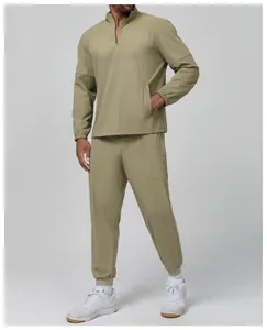 Detailed view of men's olive green stand-collar lightweight athletic track suit set