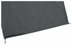 Macro detail of men's lightweight outdoor jacket showing adjustable drawstring hem and toggles
