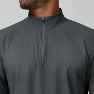 Men's athletic dark gray 1/4 zip jacket with a stand collar for hiking and city commuting