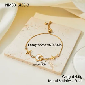 Detailed view of adjustable gold stainless steel bracelet with pearl moon and stars