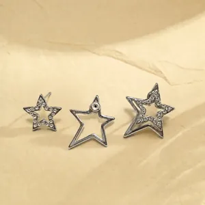 Detailed view of minimalist silver double-layered star earrings featuring rhinestone accents