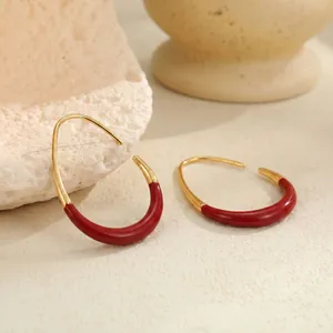 Retro burgundy enamel gold-edged C-shaped hoop earrings for a classic look.