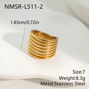 Detail view of gold stainless steel multi-layer ribbed ring with size measurements