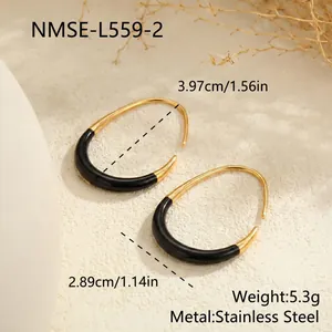 Close-up of vintage black enamel C-shaped earrings made of durable stainless steel.