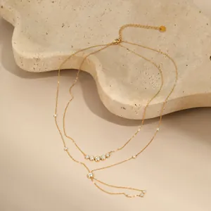 Close-up of elegant double-layer gold Y-shaped necklace decorated with zircon stars