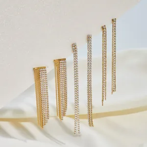 Close-up of vintage stainless steel long tassel earrings with sparkling rhinestones