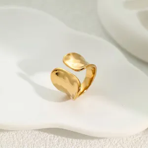 Detail view of the elegant hammered texture on this light luxury gold adjustable ring.