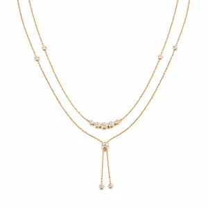 Elegant double-layered gold Y-necklace with clear zircon stones on a white background.