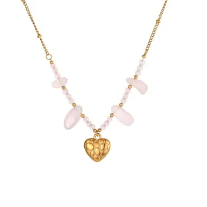 Detailed view of stainless steel necklace with rose quartz beads and heart pendant.