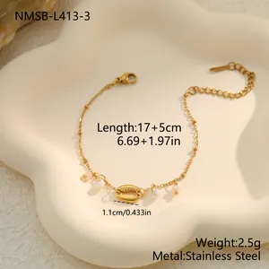 Detailed view of gold stainless steel shell and pearl bracelet with size specifications