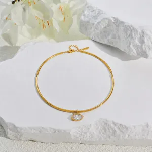 Close-up of gold-plated stainless steel choker with a marquise-cut crystal pendant