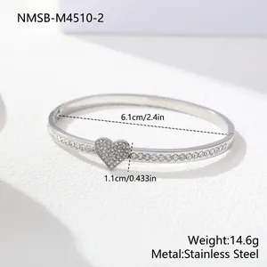 Detail view of heart bangle with 6.1cm diameter and stainless steel material
