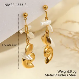 Close-up of 7cm gold stainless steel marine earrings with shell and conch charms