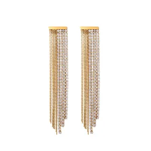 Detail view of gold-tone stainless steel tassel earrings with shimmering rhinestones
