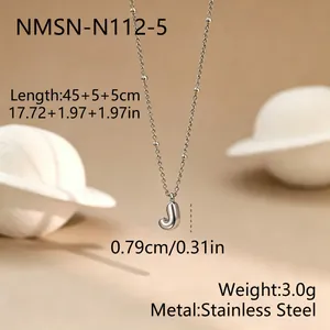 Detailed view of silver stainless steel bead chain necklace with bubble J pendant.