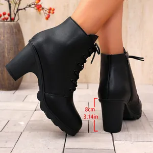 Detail of black lace-up chunky high heel boots with 8cm/3.14in heel height measurement