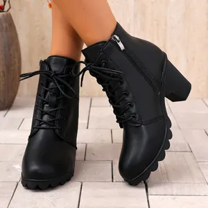 Detailed view of women's black chunky heel lace-up ankle boots with side zipper design