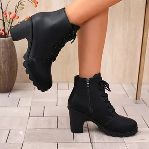Elegant black chunky high heel ankle boots for women featuring a lace-up round toe design