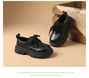 Detailed view of black genuine leather British style school shoes for boys with thick soles
