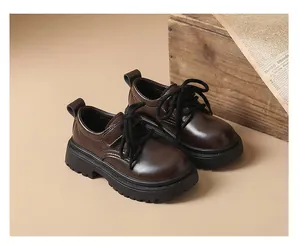 Vintage brown leather boys' Oxford shoes with thick soles in a classic British style.