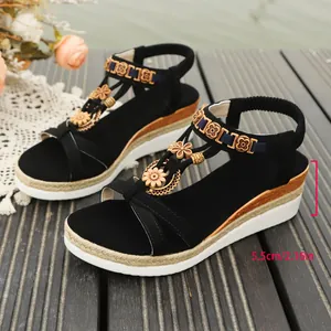 Close-up detail of Bohemian black wedge sandals showing the 5.5cm platform heel height.