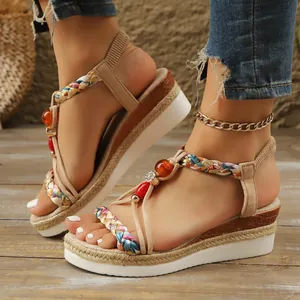 Bohemian wedge sandals featuring colorful beads and woven straps on a stylish platform sole