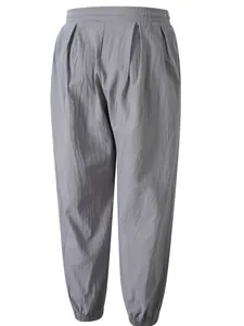 Pantalones casuales de algodón y lino para hombre con cintura elástica y puños en tobillo