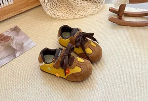 Stylish Korean style kids German trainer shoes in yellow and brown suede for toddlers.