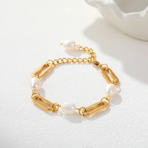 Close-up shot of elegant gold-plated stainless steel chain bracelet with white pearls