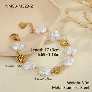 Detailed macro view of gold flower and baroque pearl bracelet with measurements.