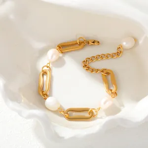 Close-up detail of the elegant gold-plated stainless steel chain and white pearl bracelet