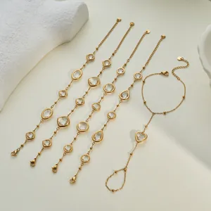 Detailed view of gold-tone thin bracelets with clear zircon in various shapes.