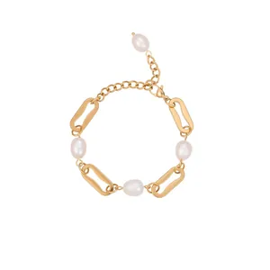 Detailed view of the gold-plated stainless steel chain bracelet with pearl accents.