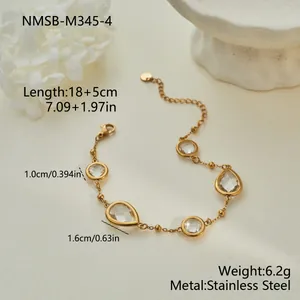 Detail view of gold stainless steel bracelet with teardrop zirconia crystals