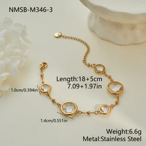 Detail view of gold stainless steel bracelet with circular clear zircon stones
