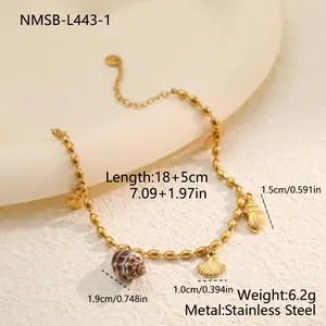 Detail view of a gold stainless steel shell charm bracelet with measurements.