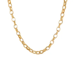 Close-up of gold-plated stainless steel embossed link chain necklace texture