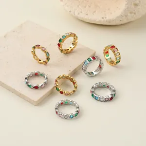 Exquisite detail view of various stainless steel rings with colorful geometric gemstones