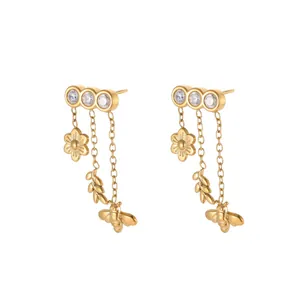 Artistic gold stainless steel bee and flower tassel earrings with clear crystal studs.