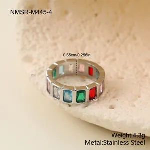 Detail of stainless steel ring featuring colorful geometric gemstones and dimensions
